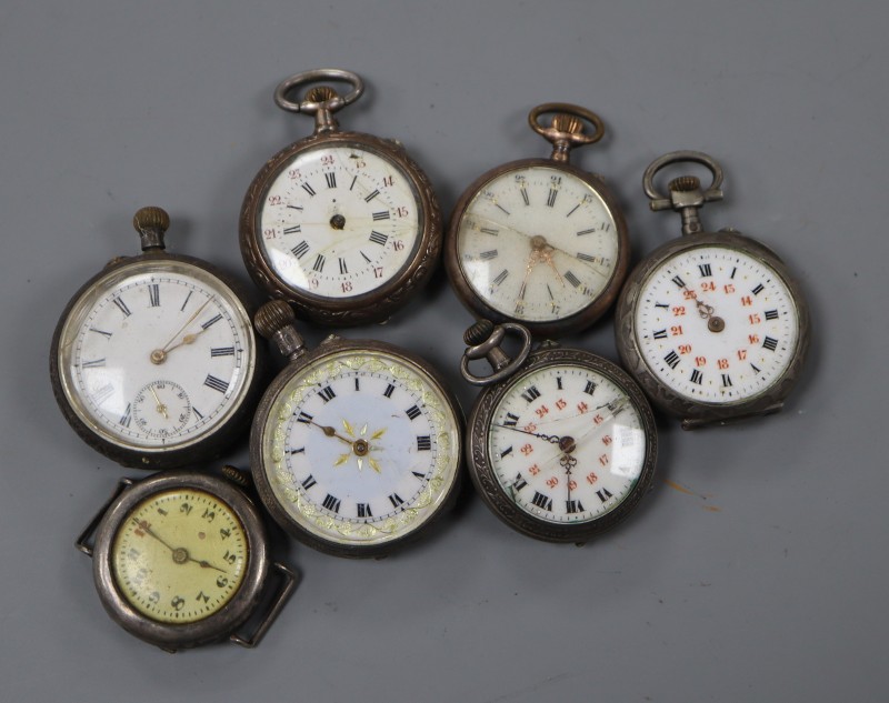 Six assorted silver or white metal fob watches and a silver wrist watch.